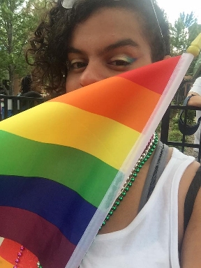 Mya in 2017 with rainbow makeup at her first Pride Parade